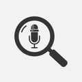 A black silhouette of a microphone inside a magnifying glass on a grey background. T Royalty Free Stock Photo
