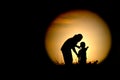 The black silhouette of Mom and kids watching the moon Royalty Free Stock Photo