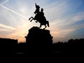 Black silhouette of monument of horse rider on background of rose sunset Royalty Free Stock Photo