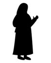 Black silhouette of a Muslim woman with her hand in the air, waving