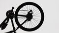 Black silhouette of a part of a modern sports bike on a white isolated background. Close up of a round bicycle wheel Royalty Free Stock Photo