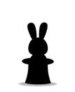 Black silhouette of rabbit sitting in the magic cylinder