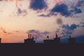 Black silhouette of the roof of a multi-storey building on the b Royalty Free Stock Photo