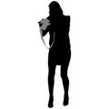 Black silhouette of slender woman in short skirt with camera in her hands