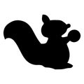 Black silhouette of a squirrel holding a nut Royalty Free Stock Photo