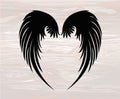 Black silhouette Wings. Vector illustration on wooden background