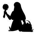 Black silhouette of a woman collecting field flowers to make a bouquet Royalty Free Stock Photo