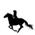 Black silhouette of a woman rider a running horse