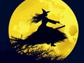 Black silhouette of a young Halloween witch in dress and a magic hat on the background of a round yellow moon