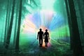 Black silhouettes of man and woman with luminous rays of energy in a dark forest on the road among the trees, the concept of aura