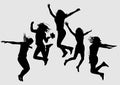 Black silhouettes of young joyful girls on a gray background that jump up
