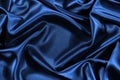 Black silk satin background. Shiny fabric with wavy folds. Beautiful fabric background Royalty Free Stock Photo