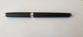 Black silver pen on white table Royalty Free Stock Photo