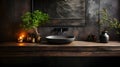 A black sink and faucet in a dark stylish bathroom with dark and wooden elements