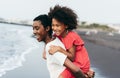 Black sister twins having fun on the beach during summertime - Love and family union concept - Main focus on left child face Royalty Free Stock Photo