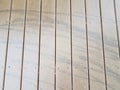 Black skid marks or lines on wood deck