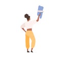 Black skin female professional painter painting on wall holding paint roller vector flat illustration. Back view