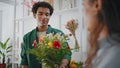 Black skin flower customer buy beautiful floristry art craft in florist shop. Royalty Free Stock Photo