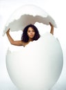 Black skined woman in big crashed egg Royalty Free Stock Photo