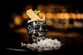 Black skull-shaped glass filled with fresh and sweet summer cocktail