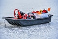 Black Sled Filled with Ice Fishing Equipment