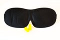 Black sleep mask on white ear plugs Royalty Free Stock Photo