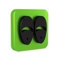 Black Slippers icon isolated on transparent background. Flip flops sign. Green square button.