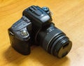 a black SLR camera with a lens Royalty Free Stock Photo