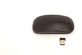 A black small computer mouse without a wire lies on a white background Royalty Free Stock Photo