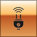 Black Smart electric plug system icon isolated on gold background. Internet of things concept with wireless connection Royalty Free Stock Photo