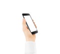 Black smart phone blank screen mock up holding in hand. Royalty Free Stock Photo