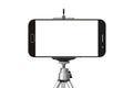 black smart phone with tripod isolated on white Royalty Free Stock Photo