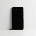Black Smartphone Back View Against White Background mobile device Royalty Free Stock Photo