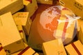 Black smartphone with World map on pile of cardboard boxes. concept of International freight or shipping service for online