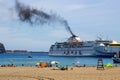 Black smoke coming from the funnel of the ferry boat Armas at Los Christianos in Tenerife as she leaves port on her latest islan