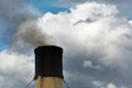 Black smoke exits the ship`s chimney