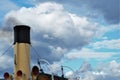 Black smoke exits the ship`s chimney