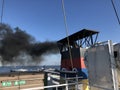 Black smoke from a ferry leaving Borkum island