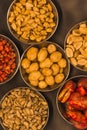 Black snack plate with different types of nuts and seeds 5