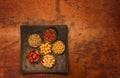 Black snack plate with different types of nuts and seeds 4