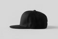 Black snapback cap mockup on a grey background, side view