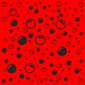 Black soap bubbles on a light red background Royalty Free Stock Photo