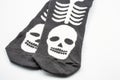 Black socks with white scull skeleton closeup. Halloween theme