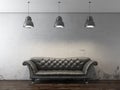 Black sofa in front of grunge wall