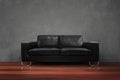Black sofa with wooden floor concrete wall in empty living room Royalty Free Stock Photo