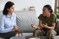 Black Soldier Woman Talking To Psychotherapist Lady During Therapy Meeting At Office Royalty Free Stock Photo