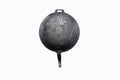 Black soot on bottom of old pan that has been heated for long time hung on wall fence galvanized sheet. Royalty Free Stock Photo