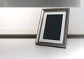 Black space on vertical silver aluminum frame on desk