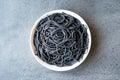 Black Spaghetti Pasta Flavored with Squid ink Cuttlefish or Inkfish. Royalty Free Stock Photo