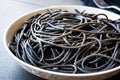 Black Spaghetti Pasta Flavored with Squid ink Cuttlefish or Inkfish. Royalty Free Stock Photo